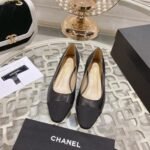 Chanel Black And Patent Leather CC Cap Toe Pumps