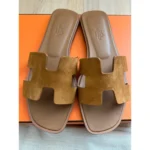 Hermès Oran Sandals In Gold Leather Finish